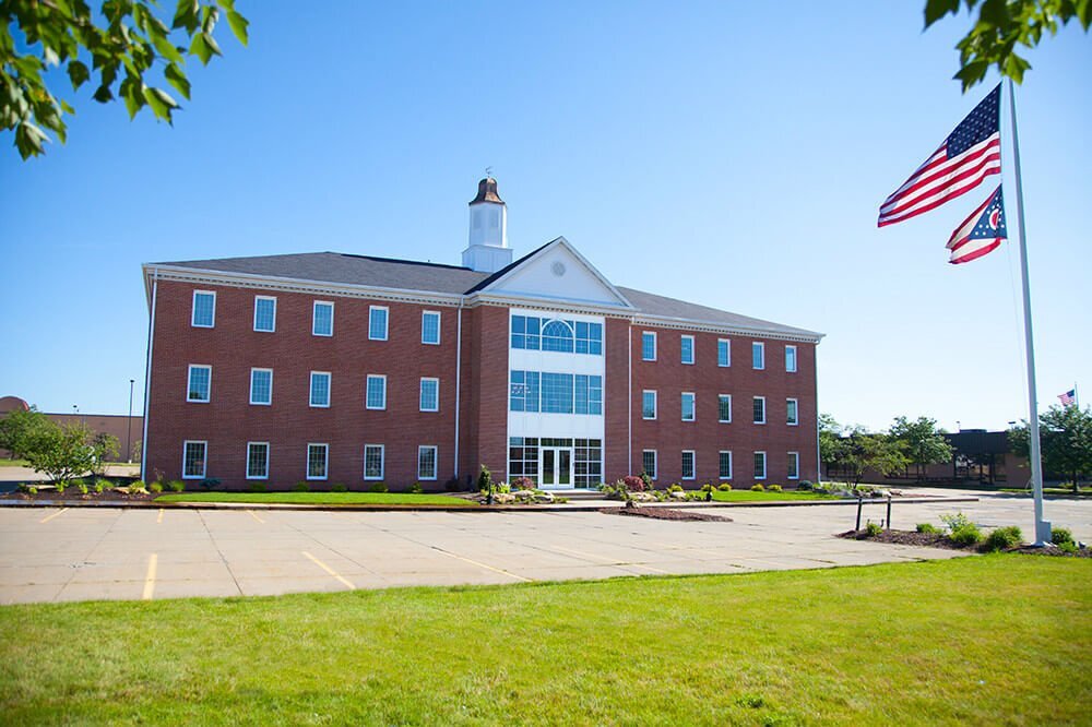 Brick office building with an American flag in front
