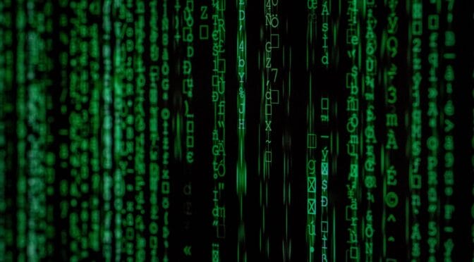 Green matrix-like code on a black background.