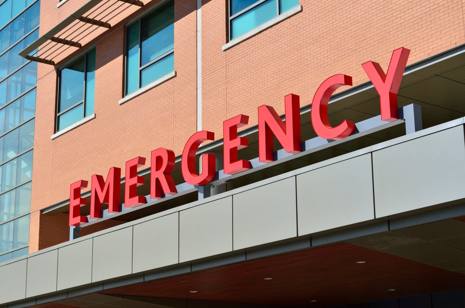 Exterior of a building with a large EMERGENCY sign